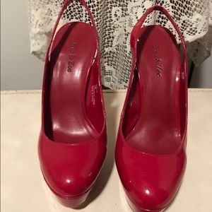 Red patent leather pumps